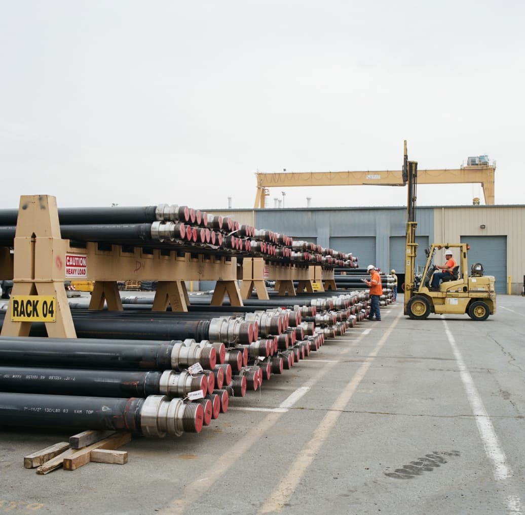 Rows of industrial line pipe extending to the horizon